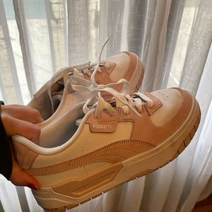 Puma Cali Dream light pink and white sneakers.